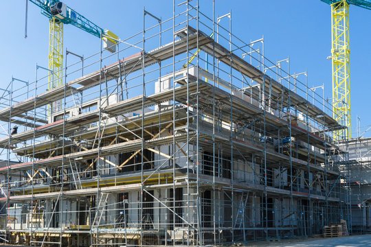 Scaffolding around a building under construction